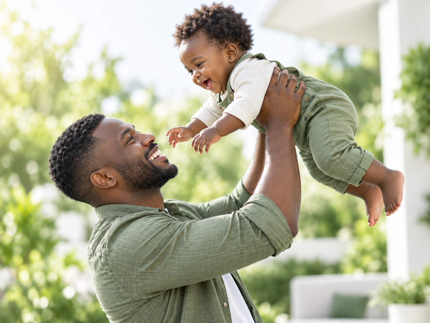 Father happily holding his child